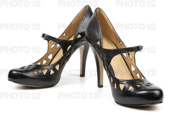 Pair black feminine loafers on high heel on white background