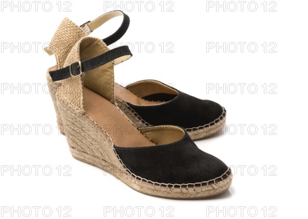 Pair of beige with black suede women's summer shoes. Isolate on white