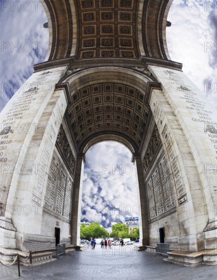 The striking and unexpected angle Arc de Triomphe in Paris. Background - the cloudy sky. Photo was taken Fisheye lens