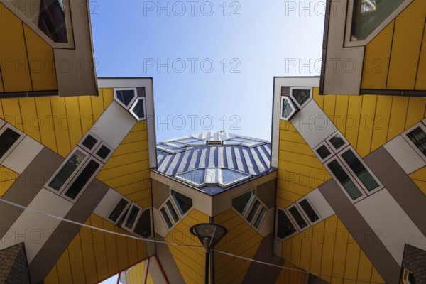 Rotterdam, Netherlands, May 8, 2022: Yellow cubic houses in Rotterdam. The Cubic Houses were designed by Piet Blom architect