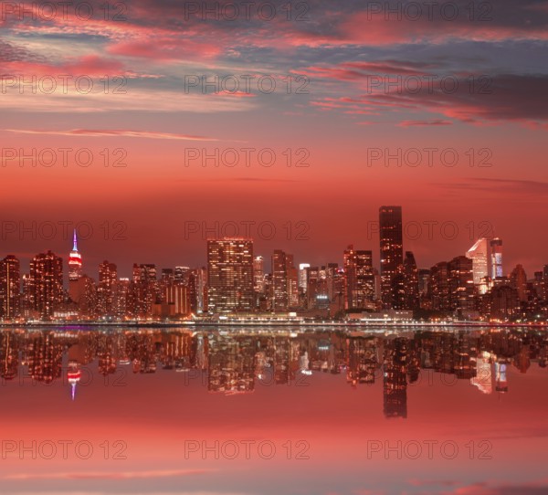 Manhattan New York skyline at sunset dusk from East River NYC USA