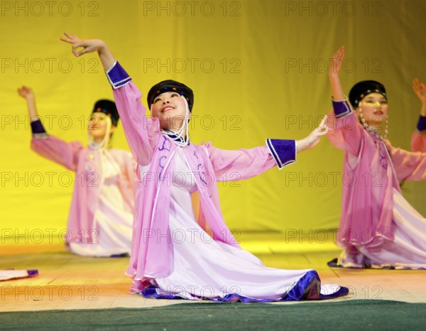 ULAN-UDE, RUSSIA - APRIL 16: Unidentified Buryat female dancers in national dresses perform at fashion show of Radzhana Baldayeva, a known hair stylist, April, 16, 2010 in Ulan-Ude, Buryatia, Russia, Europe