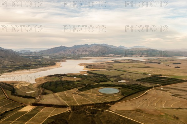 Fields, irrigation basin, river, clouds, sky, dirt road, meadows, bushes, mountains, Riviersonderend, Theewaterskloof, Theewaterskloofdam Klipkraal, Western Cape, South Africa, Africa
