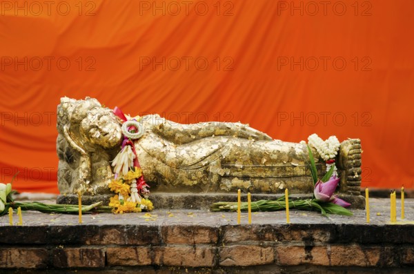 Reclining buddha statue with gold leaf in thailand