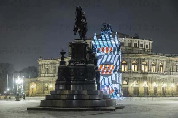 On 13 and 14 February 1945, Dresden was heavily destroyed in three Allied bombing raids. Every year, the people of Dresden commemorate this event at various events. A long human chain symbolises the protection of the city centre. With S?I?L?E?N?T?I?U?M?, OchoReSotto presents a video installation on the façade of the Semperoper that translates the architecture, history and gestures of the opera house into a haunting visual language. Historical fragments, architectural patterns and precisely documented movements merge into lively compositions that oscillate between dynamism and deliberate standstill, Dresden, Saxony, Germany, Europe