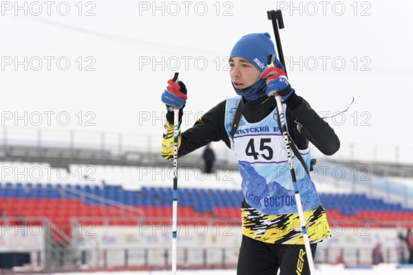 Kamchatka sportsman biathlete Storonkin Nikita skiing on distance biathlon stadium. Open regional youth biathlon competitions East Cup. Petropavlovsk City, Kamchatka Peninsula, Russia, April 12, 2019, Europe