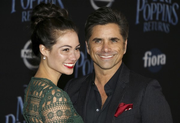 Caitlin Mchugh and John Stamos at the World premiere of Disney's 'Mary Poppins Returns' held at the Dolby Theatre in Hollywood, USA on November 29, 2018