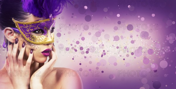 Beautiful woman with dramatic mekaup and pruple lipstick wearing puprle mask. Light background. Golden, Toronto, Canada, North America