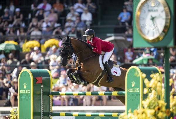 Tiffany Foster of Canada and riding Figor compete in the first round of the 1.60m CPKC International during the Spruce Meadows Masters, presented by Rolex, in Calgary, Alberta, Canada, North America