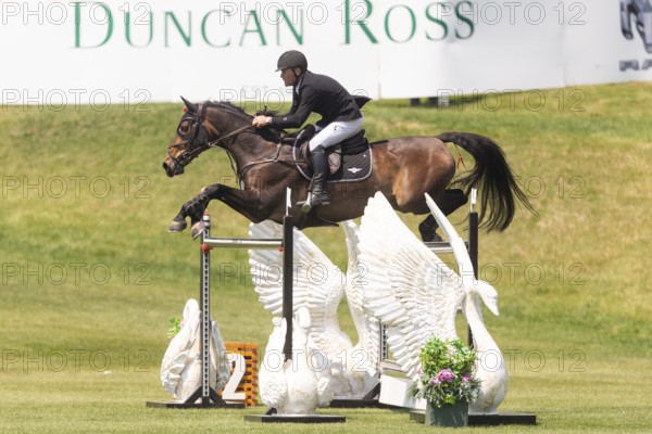 Kyle King of the United States and riding Odysseus, compete in the 1.60m Grand Prix during The Continental international competition at Spruce Meadows, in Calgary, Canada, North America