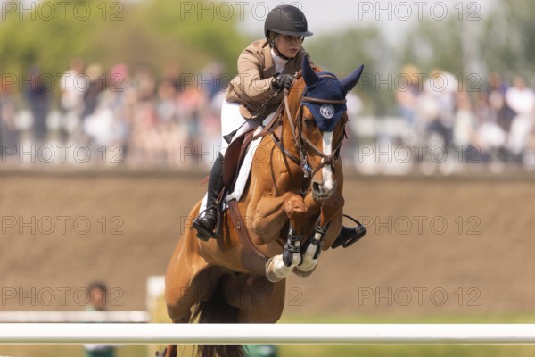 Elena A. Haas, from the United States and riding Claude, compete in the 1.60m Grand Prix during The Continental international competition at Spruce Meadows, in Calgary, Canada, North America
