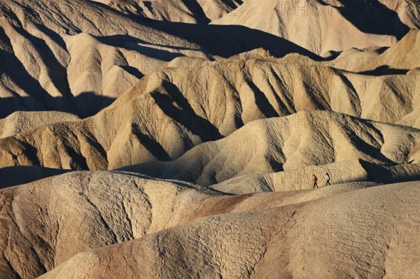 Hikers at Zabriskie Point in Death Valley National Park, California, USA, North America