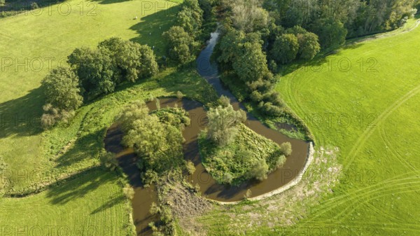 Aerial view of a beautiful green landscape with a small river flowing through. It is in the eastern part of the Netherlands