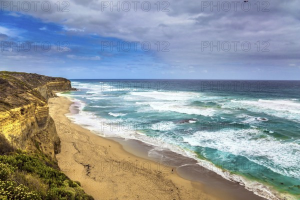 Great Ocean Road of Australia. Picturesque ocean bay with clear green water. The coastal cliffs are composed of sandstone. The The concept of exotic, active and photo-tourism