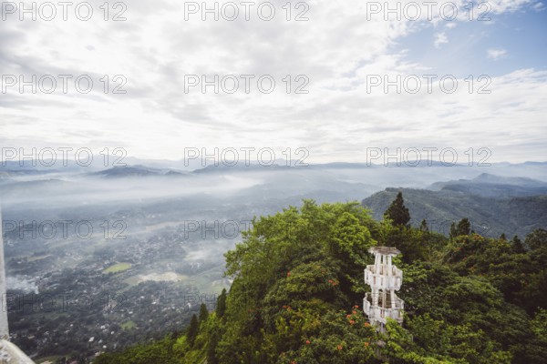 Panoramic view of a hilly, wooded landscape with a tower in the foreground, Anamanawa Tower, Sri Lanka, Asia