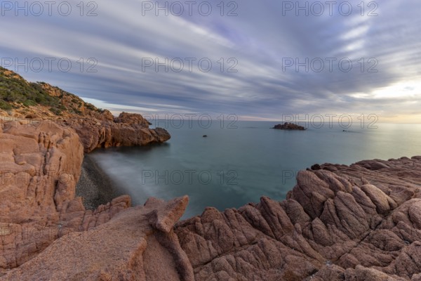 Coast with bizarre red rocks and sea view at sunset, long exposure, Spiaggia di Cala E'Luas, Ogliastra, Sardinia, Italy, Europe