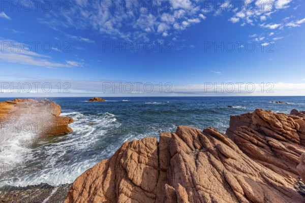 Coastal landscape with red rocks and surf in blue sky and sunshine, Spiaggia di Cala E'Luas, Ogliastra, Sardinia, Italy, Europe