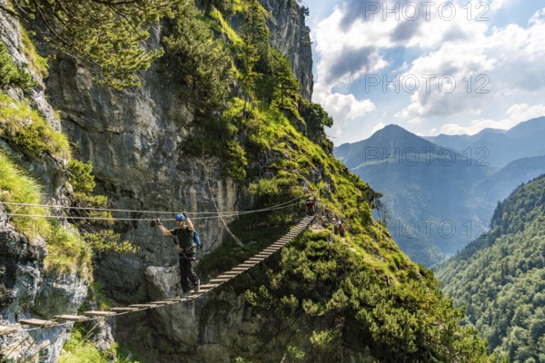 Sports via ferrata near the valley with a suspension bridge and a great view of the Berchtesgaden mountains