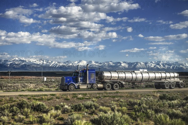 Truck on Interstate 80 in front of the Ruby Mountains, Toiyabe National Forest, Elko, Nevada, USA, North America