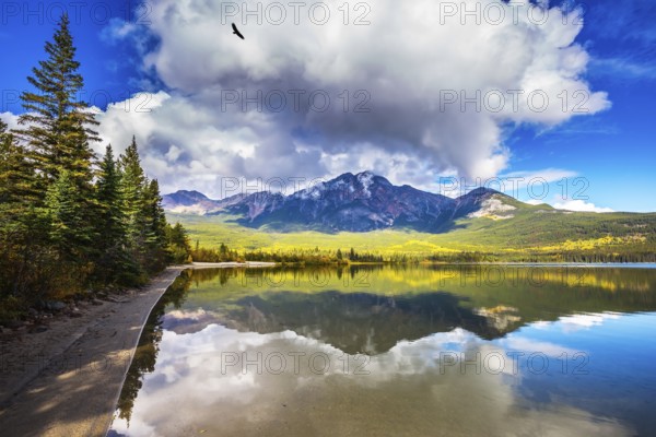 Frosty morning in the Rocky Mountains, Canada. Pyramid Mountain reflected in the smooth water of Pyramid Lake