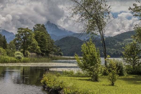 Lake Weissensee to the west of Füssen in the district of Ostallgäu, with the Ammergau Alps and the Säuling in the background