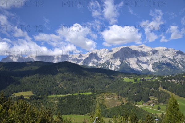 Panoramic view of the mountains with the Dachstein massif in green Styria - Austria