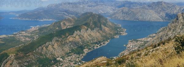 Bay of Kotor from the heights. View from Mount Lovcen to the bay. View down from the observation platform on the mountain Lovcen. Mountains and bay in Montenegro. The liner near the old town of Kotor