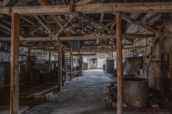 Old abandoned paper factory. Historic and typical factory building as a lost place. Destruction and decay are damaging the substance. Original machines and objects can be found here in Sweden