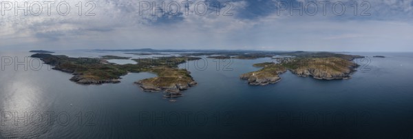 A wide panorama landscape of the islands and coastline of Baltimore Harbor in West Cork County in Ireland