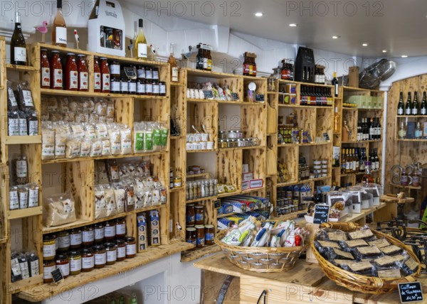 Saintes-Maries-de-la-Mer, France, 4 March, 2023: interior view of a typical Camargue souvenir shop with many regional and local food specialties, Europe