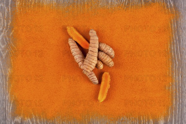 Turmeric root and curcuma spice background. Anti-inflammatory herbal medicine, nutrional supplement