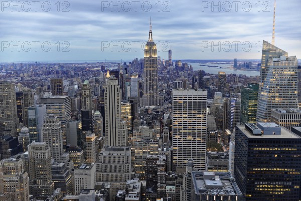 Rockefeller Center observation deck, Panoramic view of the dense New York City skyline, Illuminated Empire State Building in the New York skyline, Manhattan, New York City, New York, USA, North America