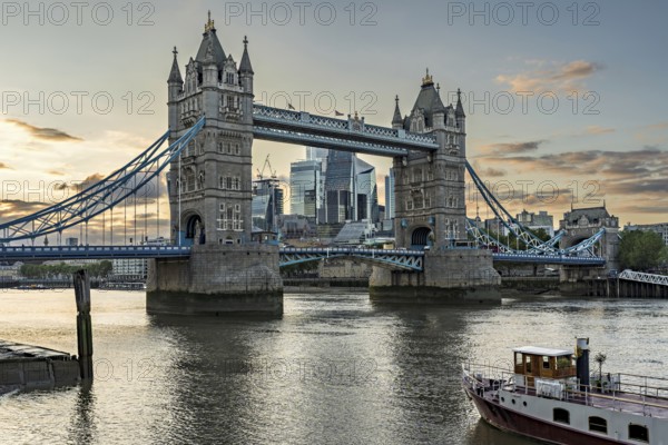 View over the Thames with Tower Bridge and the skyline in the evening light, London, England, Great Britain