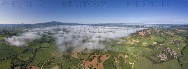 Tuscany aerial panorama landscape of farmland hill country at morning. Italy