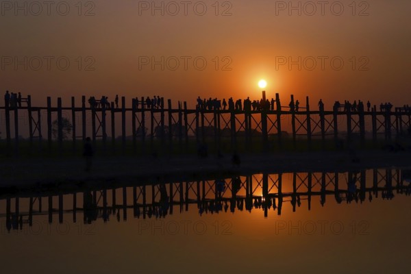 Famous U-Bein teak bridge at sunset on Taungthaman lake in Amarapura, Mandalay division, Myanmar, Asia