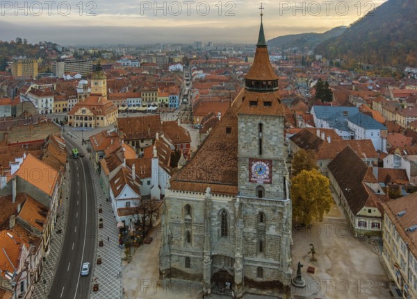 Aerial view of Brasov old town with Black Church and Piata Sfatului square in autumn morning, Transylvania region, Romania, Europe