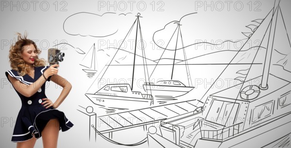 Glamorous pin up sailor girl in the harbour filming yachts with an old retro cinema 8 mm camera and standing in the wind, on grey sketchy background