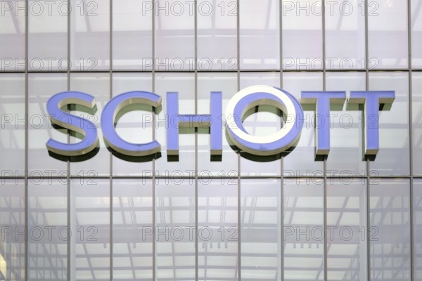 Mainz, Germany - February 10, 2018: The glass façade of the Schott AG headquarters in Mainz with tinted windows and logo on 10 February 2018 in Mainz
