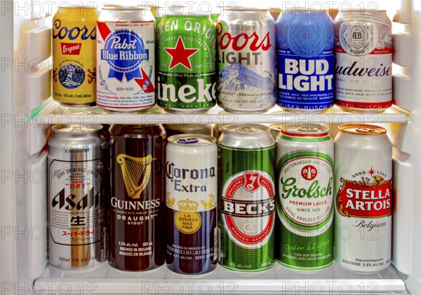 Calgary, Alberta, Canada. Jun 9 2020. Various beer cans of craft beers, domestic and imported beers from around the world on a mini fridge in a house cooler.Alcohol drinks background, different beer styles