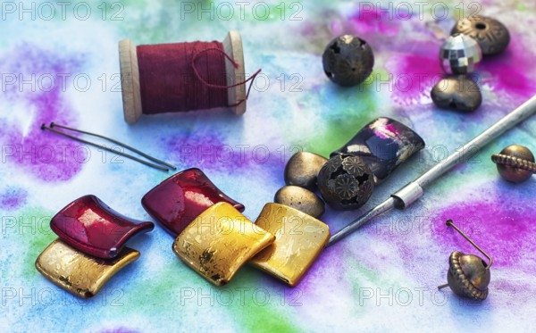 Beads, thread, wire and tools for needlework in variety of styles