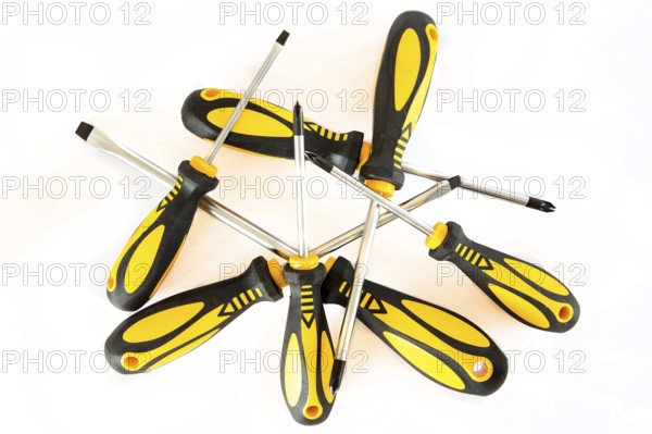 Set of screwdrivers with rubber black and yellow handles isolated on a white background