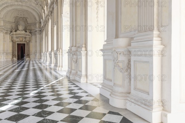 Reggia di Venaria Reale, Italy, October 2022: corridor perspective, luxury marble, gallery and windows, Royal palace, Europe