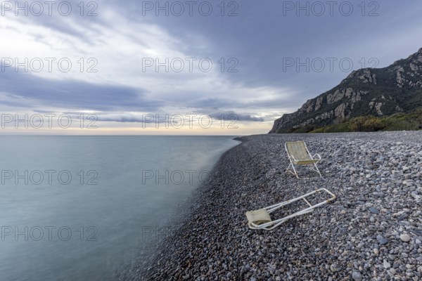 Lonely, deserted, deserted beach with two abandoned deckchairs, long exposure, Coccorocci, Ogliastra, Sardinia, Italy, Europe