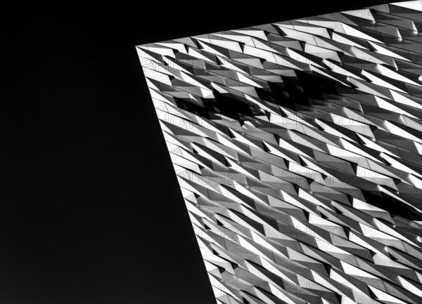 Belfast, United Kingdom, 21 August, 2022: close-up architectural detail of the steel and aluminium Titanic Museum in downtown Belfast in black-and-white, Europe