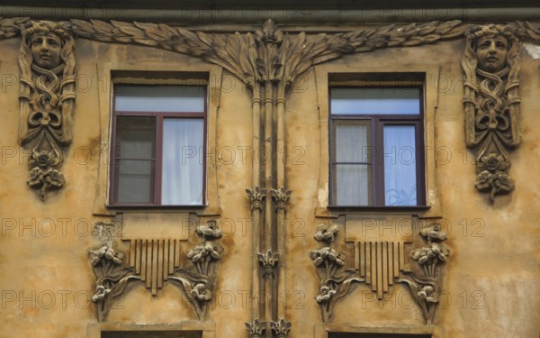 Fragment of the facade with a balcony of an Art Nouveau-style residential building in the city center