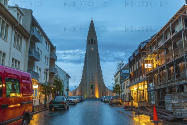 REYKJAVIK, ICELAND, JULY 06::View down a street of illuminated buildings of Hallgrimskirkja church, which is a Lutheran parish church and the largest in Iceland on July 06, 2013 in Reykjavik, Iceland, Europe