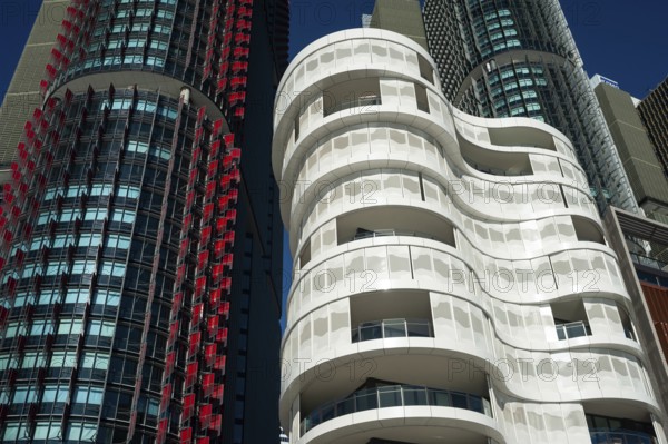 16 Sep 2018, Sydney, New South Wales, Australia, A view of modern residential buildings at Anadara Residence, office towers and restaurants along the pedestrianised Wulugul Walk in Barangaroo South. The buildings are located on the banks of Darling Harbour with the International Towers towering in the background, Oceania