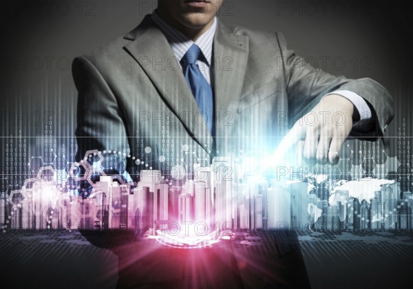 Businessman touching colorful hologram of modern business district 3d model. Architect presenting construction project. Investing in real estate concept. World economy and global financial markets