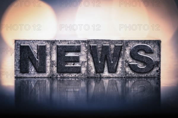 The word NEWS written in vintage ink stained letterpress type