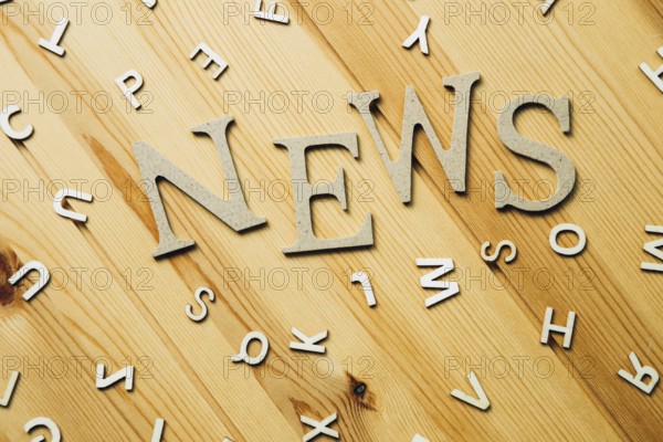 News word on wooden table